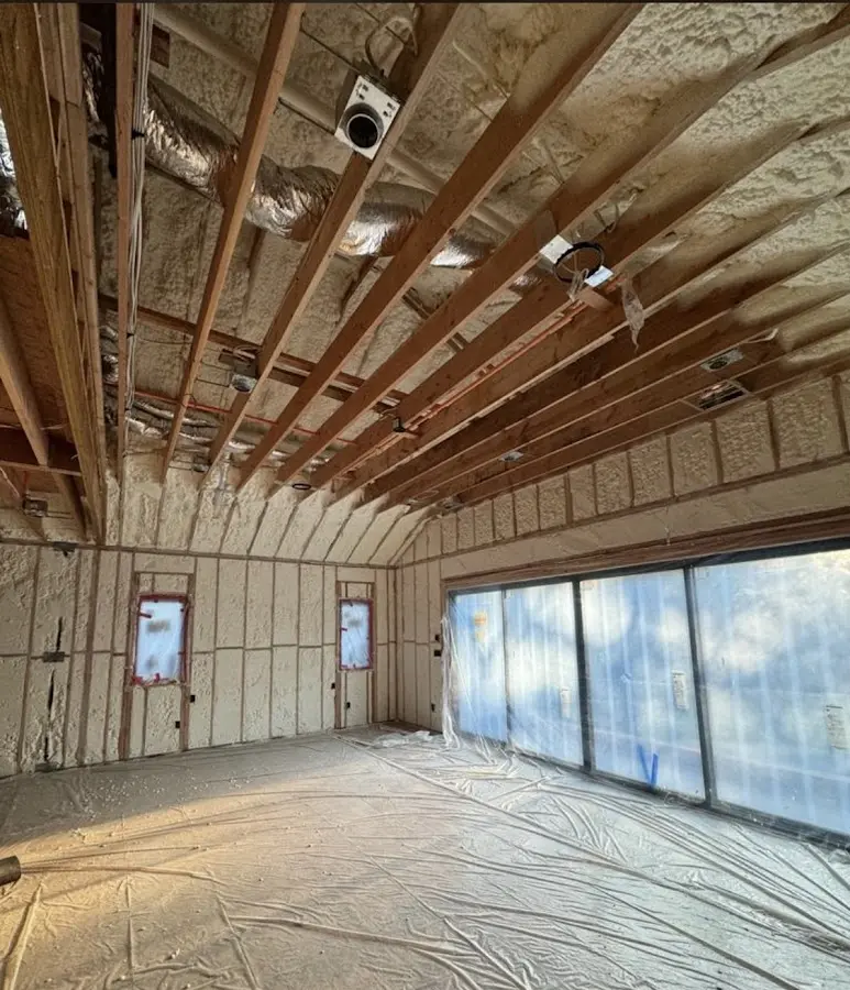 Interior walls and ceiling insulated with spray foam during new construction in El Dorado